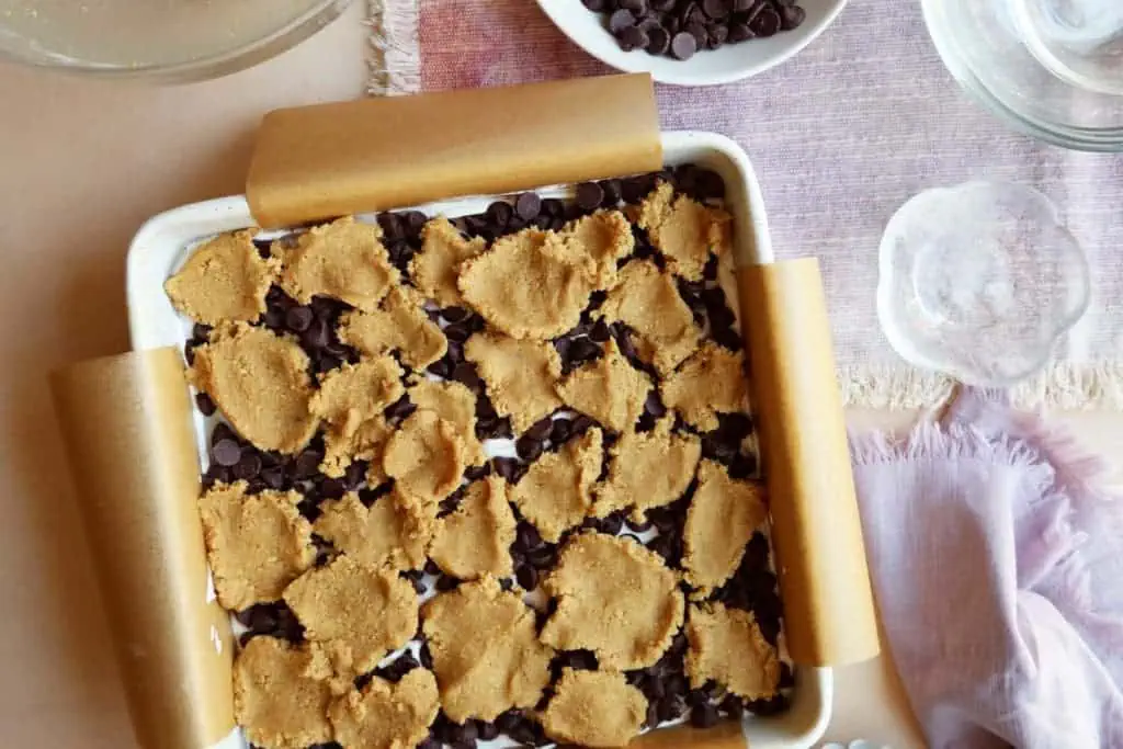 Pieces of crust pressed together for moon pie recipe topping.