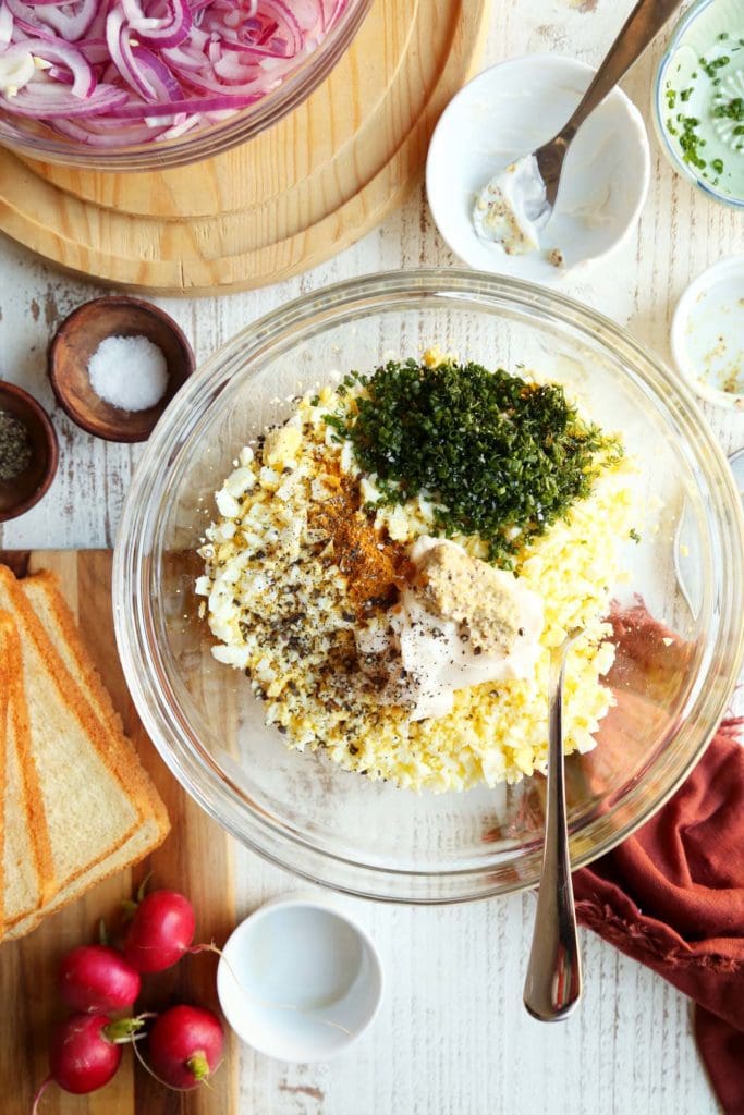 Egg salad ingredients in a medium mixing bowl.