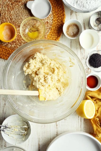 Mixing doughnut batter in medium bowl with a spatula