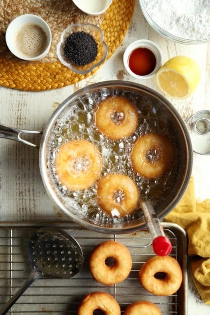 Frying old-fashioned doughnuts in hot oil.
