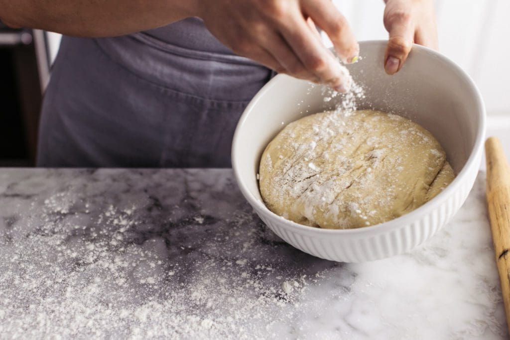 Flouring risen dough.