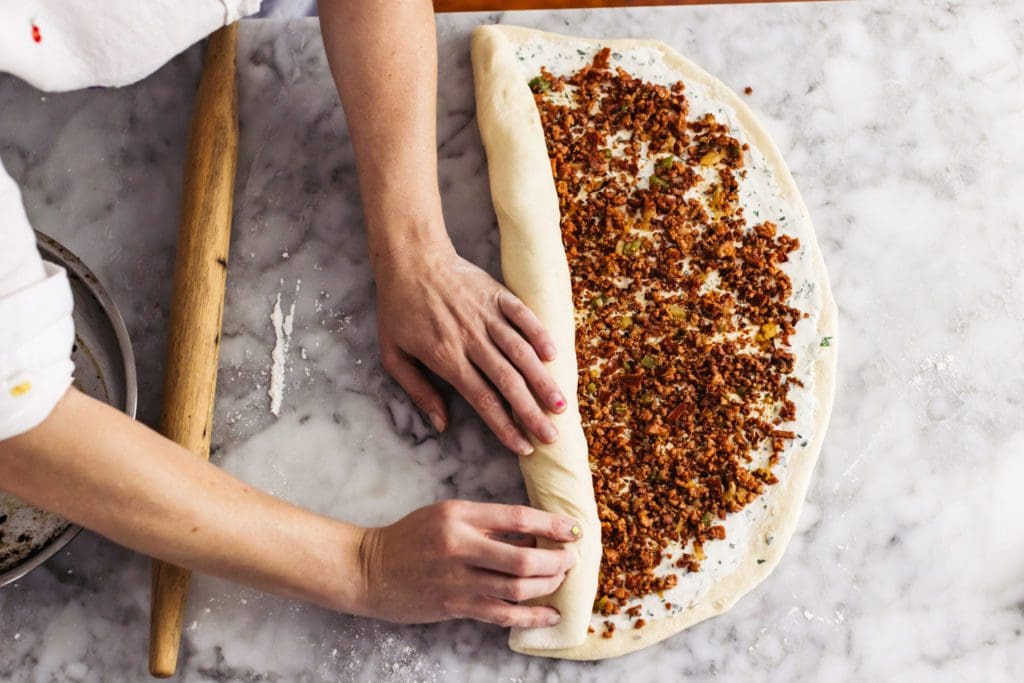 Rolling filled sausage roll recipe.