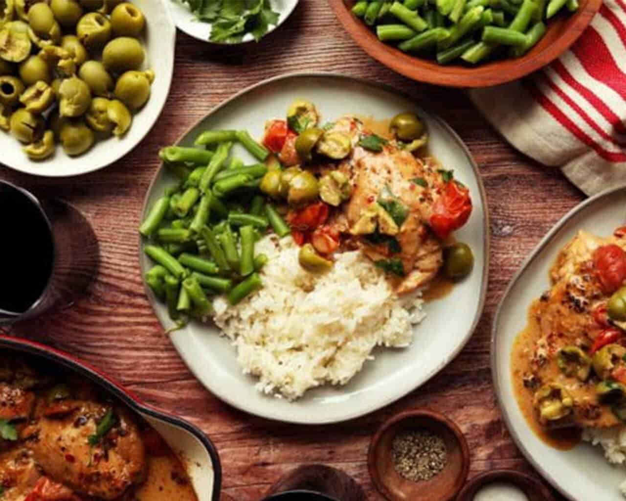 Marry Me Chicken recipe plated with rice and green beans.