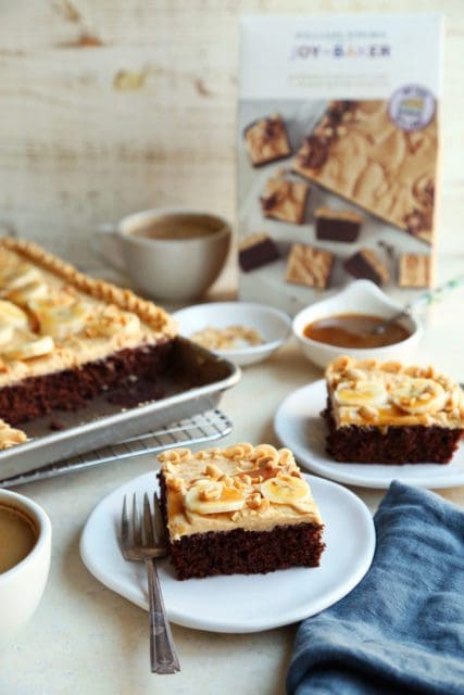 Slices of chocolate espresso cake with peanut butter frosting and sliced bananas.