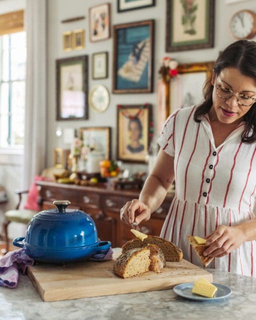 joy slicing no-knead rye bread.