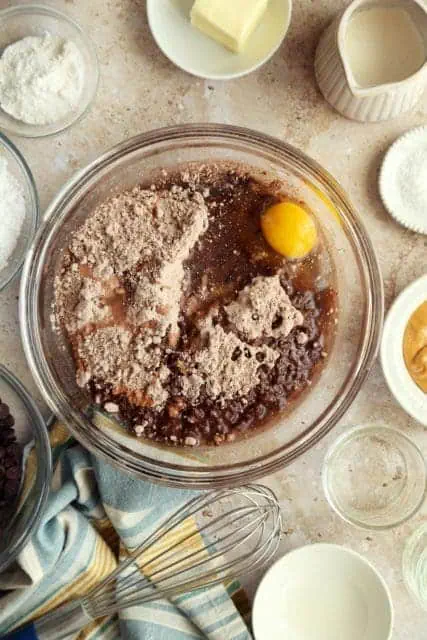 box brownie mix in a bowl with oil, egg, and water