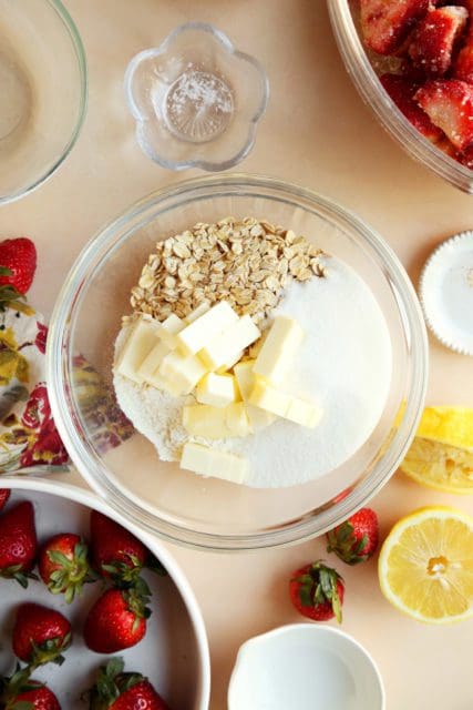 Crumble topping ingredients for strawberry pie in medium bowl.