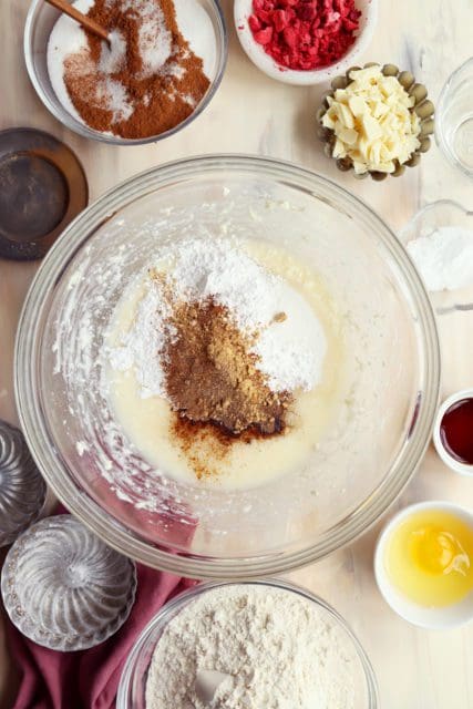 Sugars added to medium bowl for chai sugar cookies.