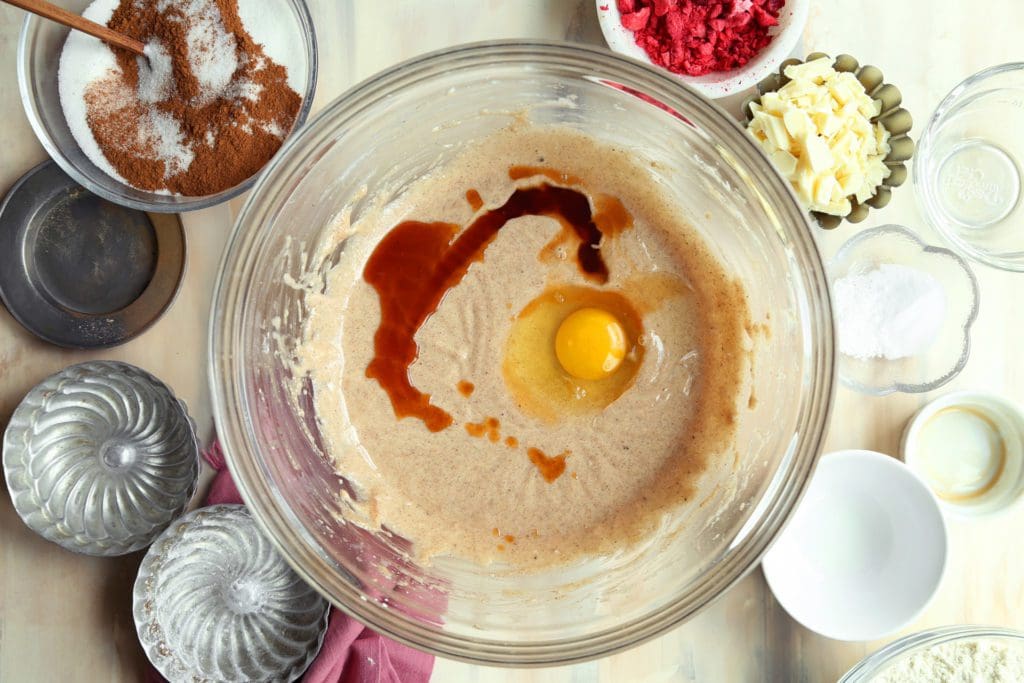 Egg and vanilla extract added to Taylor Swift cookie batter.