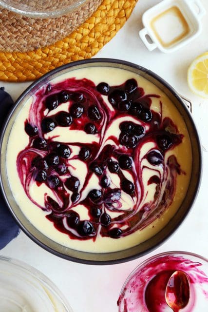 Blueberry sauce swirled over gooey butter cake before baking.