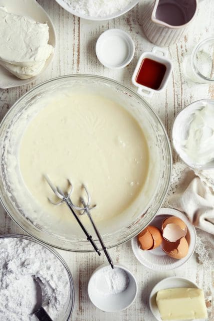 Coconut cake with cake mix batter mixed in large bowl.