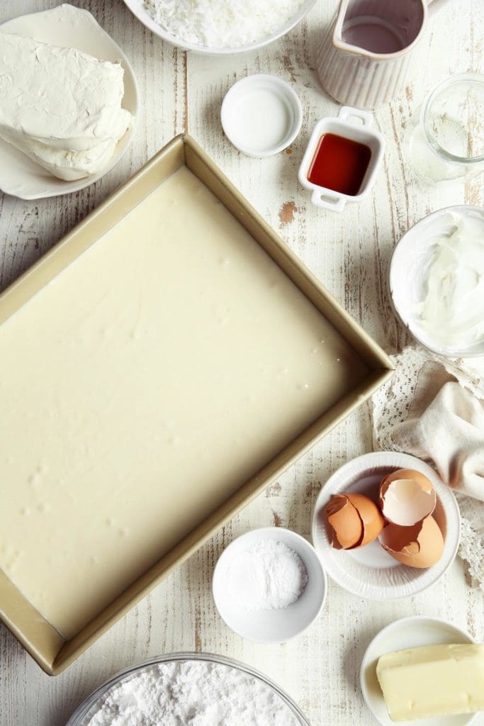 Coconut cake batter poured into 9x13-inch pan.