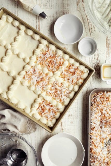 Toasted coconut place on top of coconut cakee.