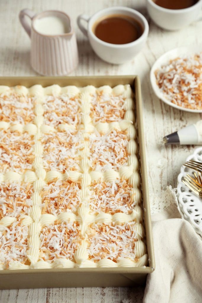 Coconut sheet cake in pan.