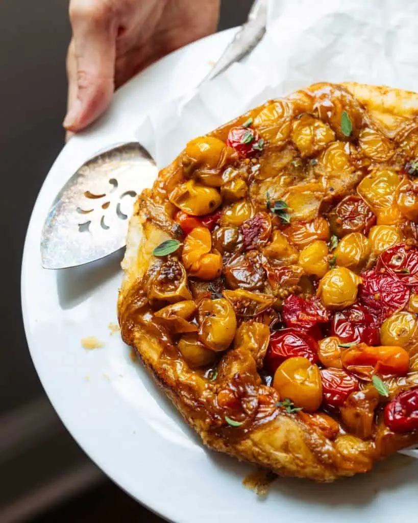 Baked tomato pie on platter.