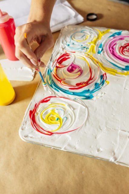swirling dye into shaving cream for dyed bandanas