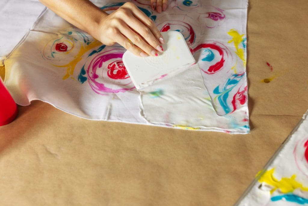 scraping shaving cream off dyed bandana