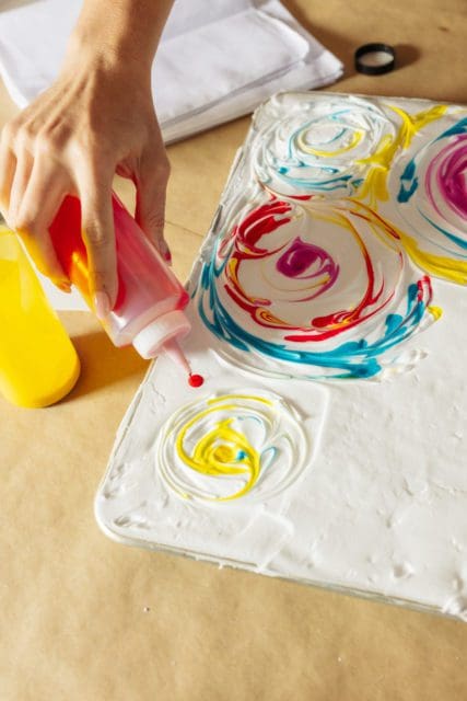 swirling dye into shaving cream for dyed bandanas