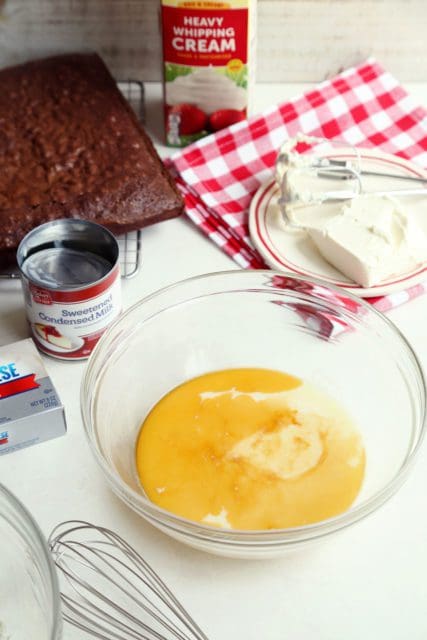 sweetened condensed milk and vanilla in a bowl for no-churn ice cream