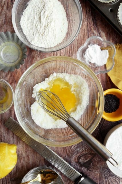 Egg and oil added to sugar for small batch muffin recipe.