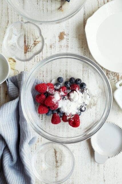 Fresh berries, sugar, and cornstarch in small bowl.