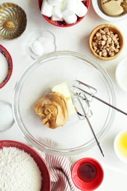 Butter and peanut butter for peanut butter cookies in bowl with beaters.