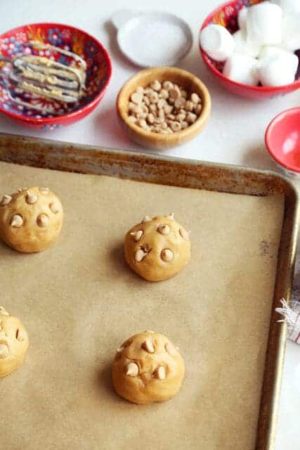 Peanut butter chips on top of fluffernutter cookie dough.