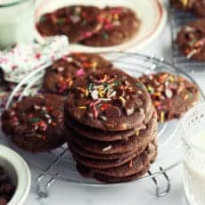 Stack of chocolate brownie cookies with sprinkles.