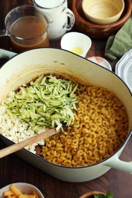 Pasta and shredded zucchini and cauliflower added to pot.