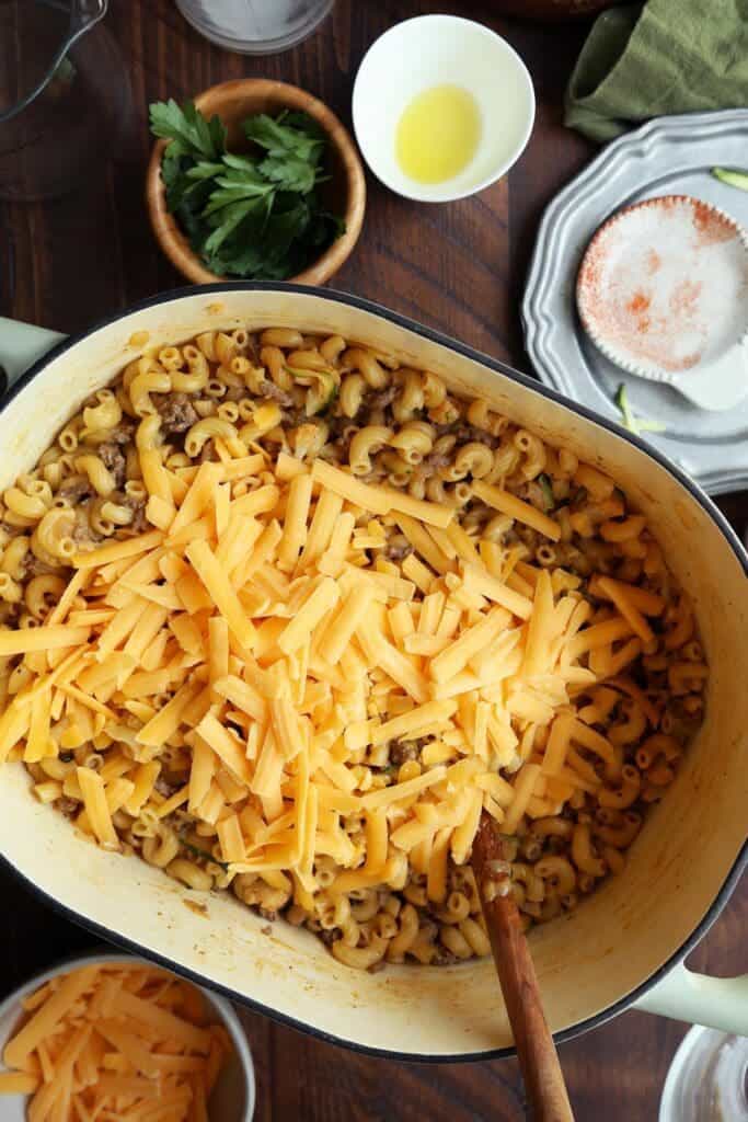 Shredded cheese added to hamburger helper dinner recipe.