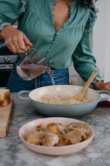 Pouring water over rice,
