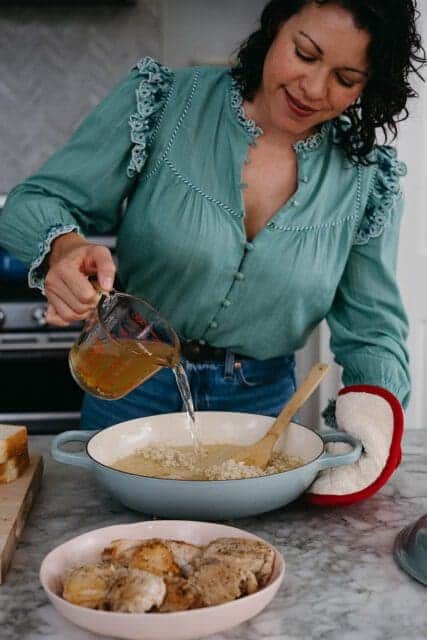 Pouring pickle juice over rice.