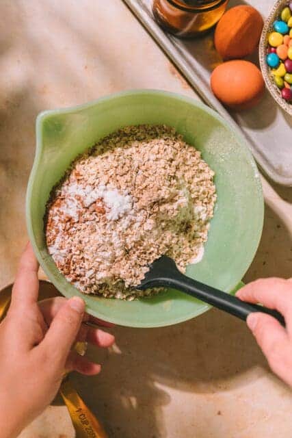 Dry ingredients for Taylor Swift cookies in a green bowl.