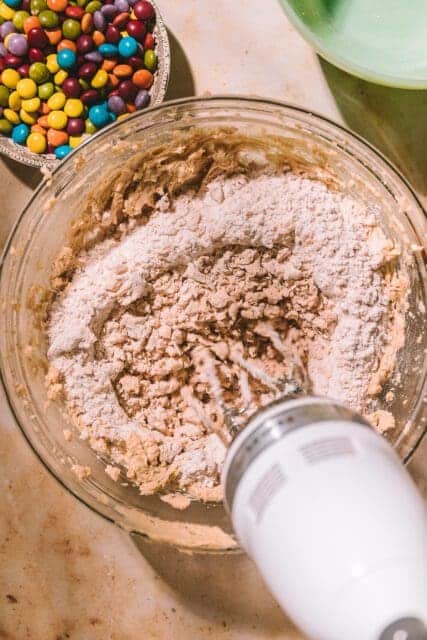 Whipping dry ingredients into Taylor Swift cookie dough.