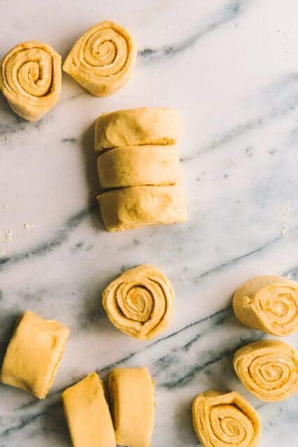 Slicing orange rolls.