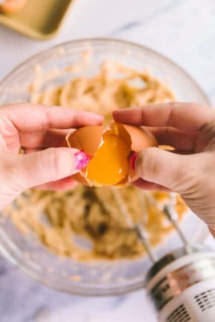 separating an egg yolk for cookie dough