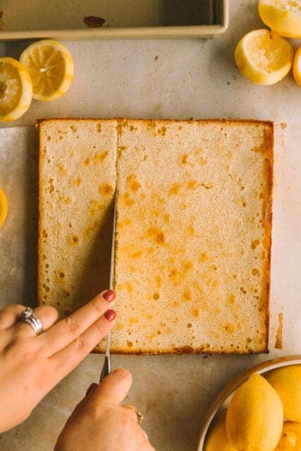 cutting freshly baked lemon bars recipe