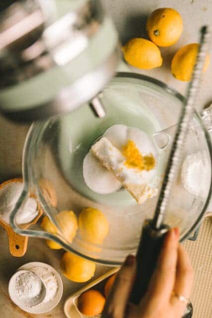 mixing butter, sugar and lemon zest together for lemon bars recipe