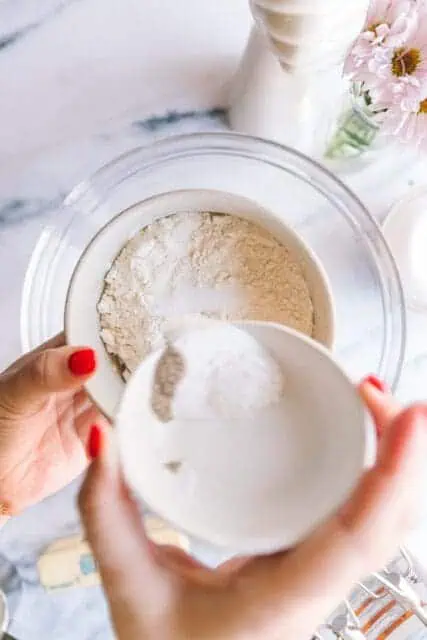 adding dry ingredients together for lemon cake