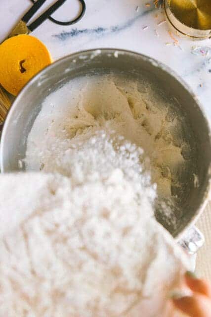 adding ingredients to mix together for a vintage birthday cake