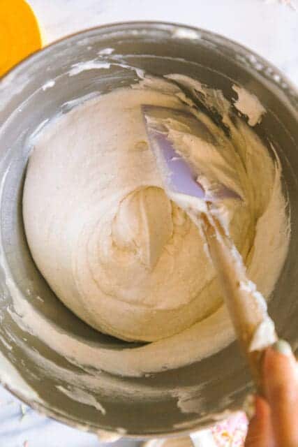 folding ingredients together with a rubber spatula