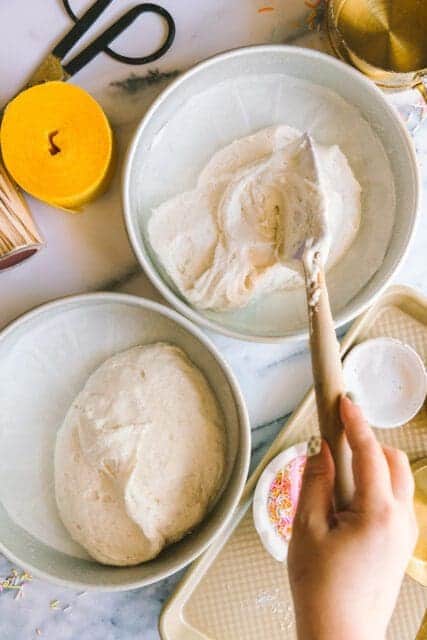 separating batter into cake pans to go into the oven