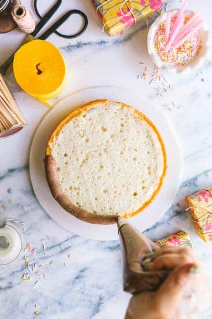 piping frosting onto finished birthday cake recipes
