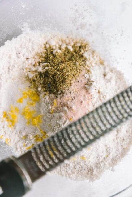 zesting lemon and spices for crêpe cake recipe