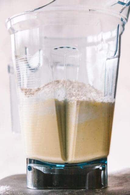 close up of blended crêpe batter in a blender