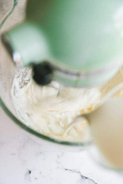 mixing frosting together to top the 4th of July cake