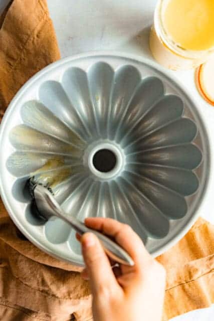 Woman greasing a Bundt pan