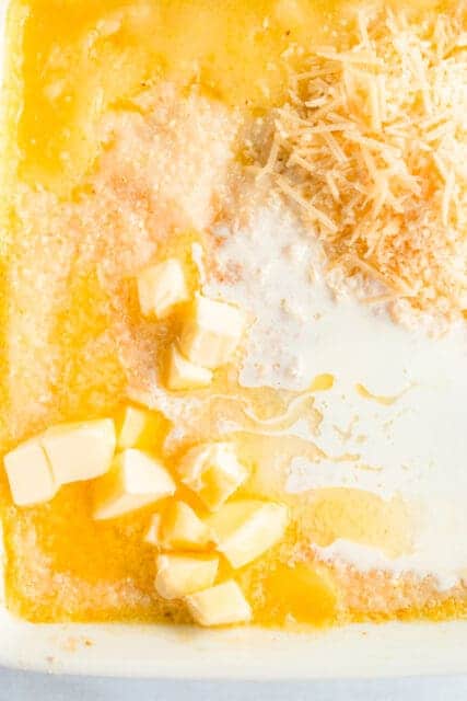 butter and parmesan melding together with polenta
