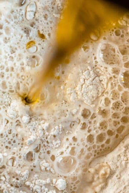 adding oil to dough mixture