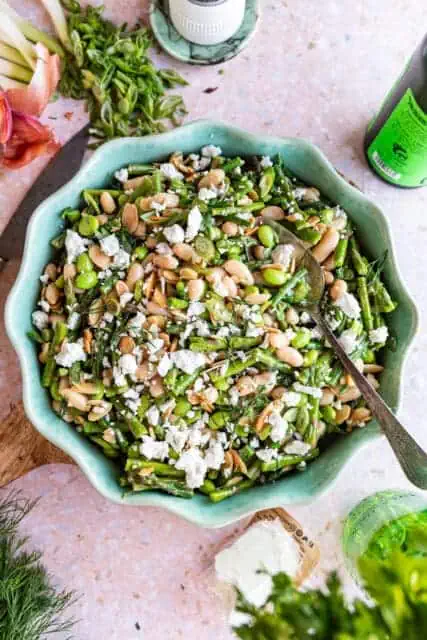 asparagus salad in a bowl with a vintage spoon